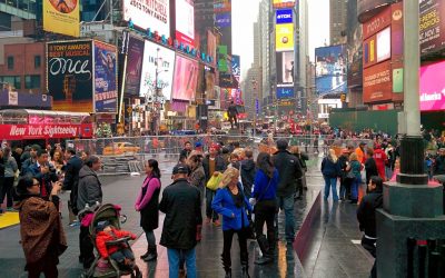 Technical Penguins: A photo of Times Square in NYC shows a lot of billboards and people milling around.